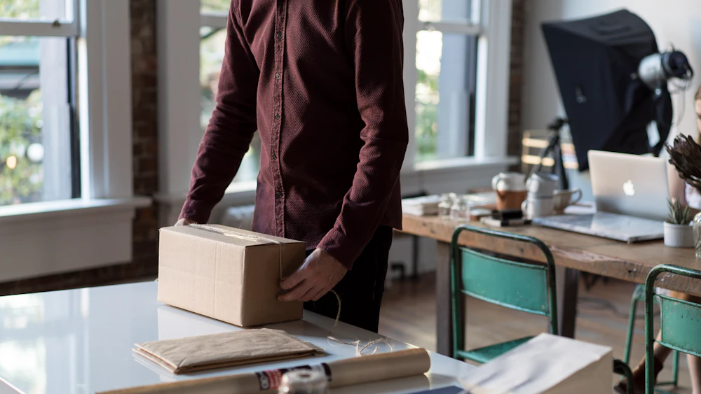 Packing an online order in a cardboard box