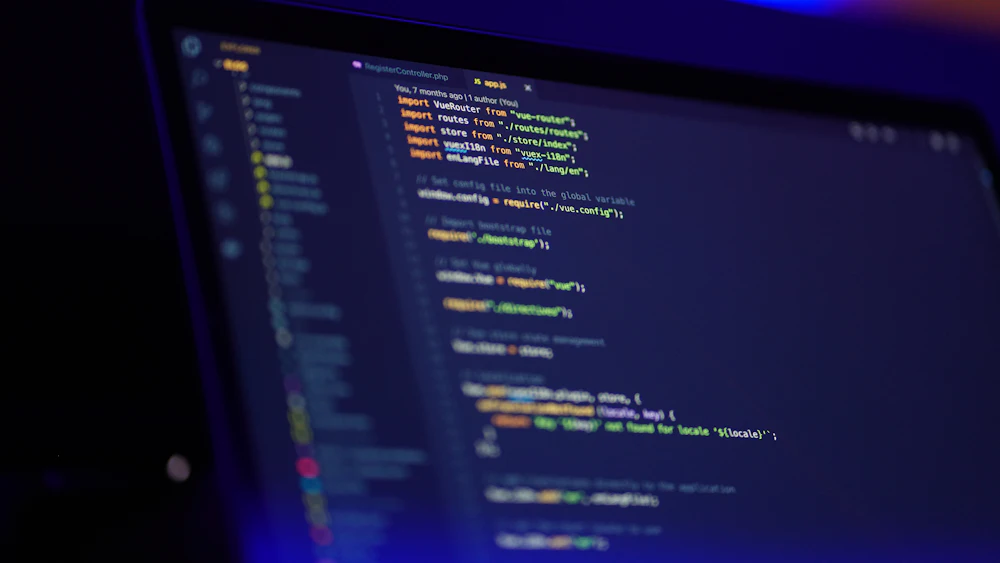 Laptop screen with colorful source code for a web project