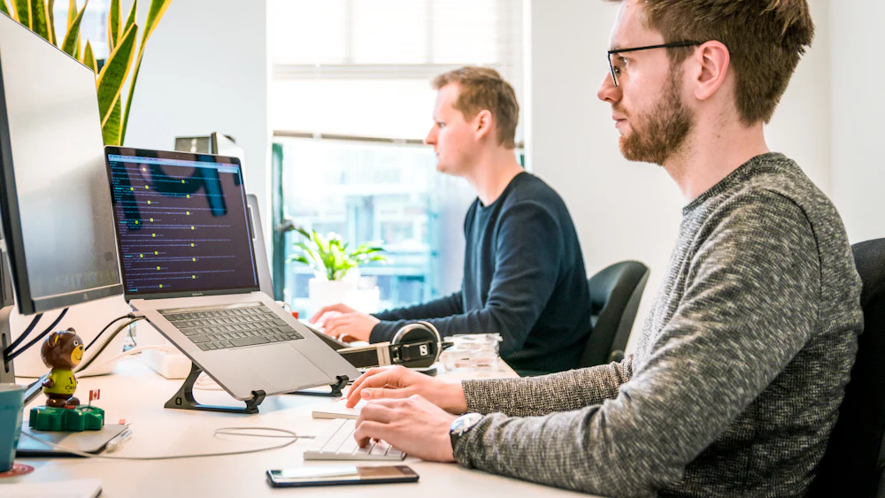 People working at computers in an open office